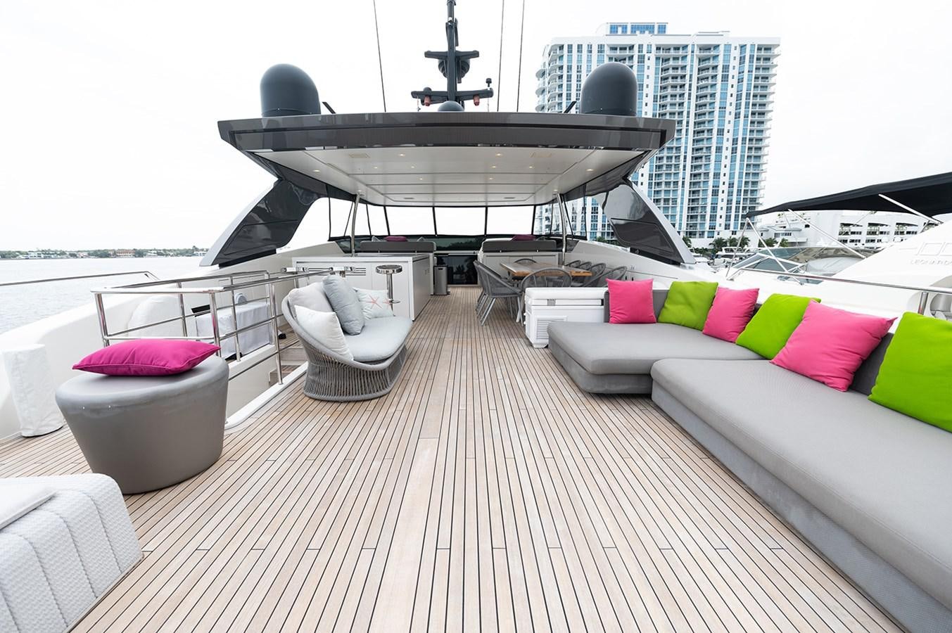 a large white boat on a deck aboard RYEN Yacht for Sale