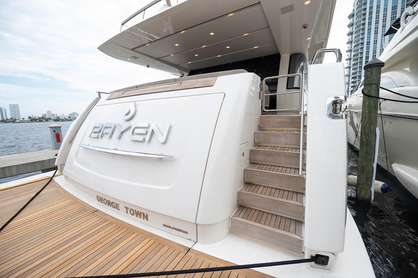 a white boat on a deck aboard RYEN Yacht for Sale