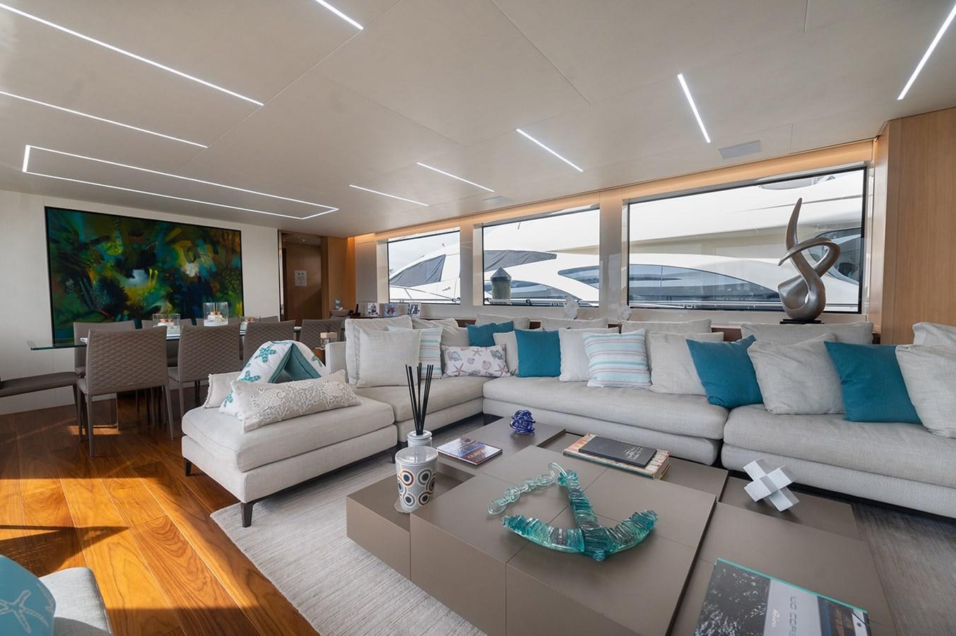 a living room with a large window aboard RYEN Yacht for Sale