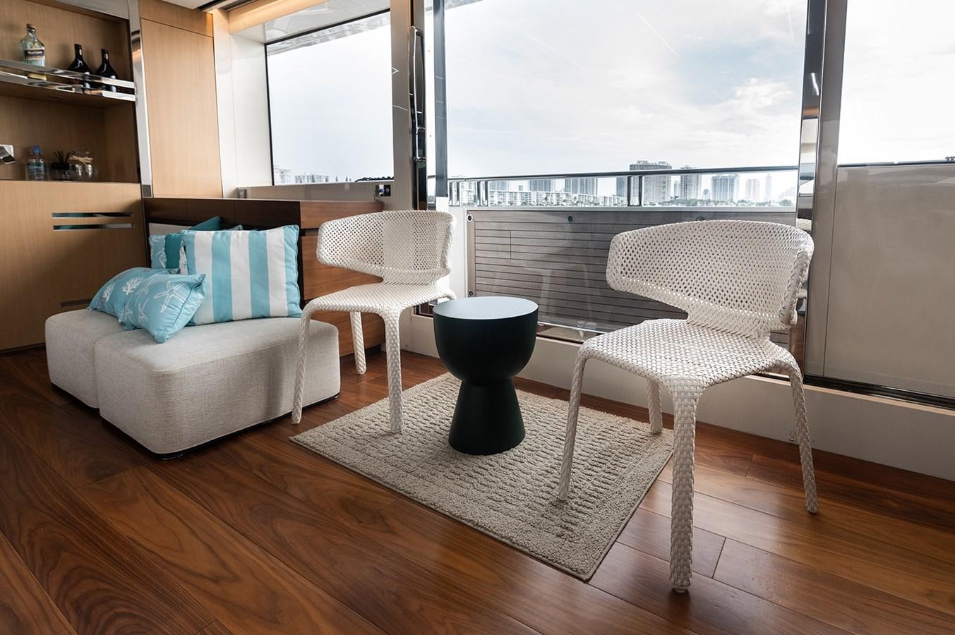 a living room with a large window aboard RYEN Yacht for Sale