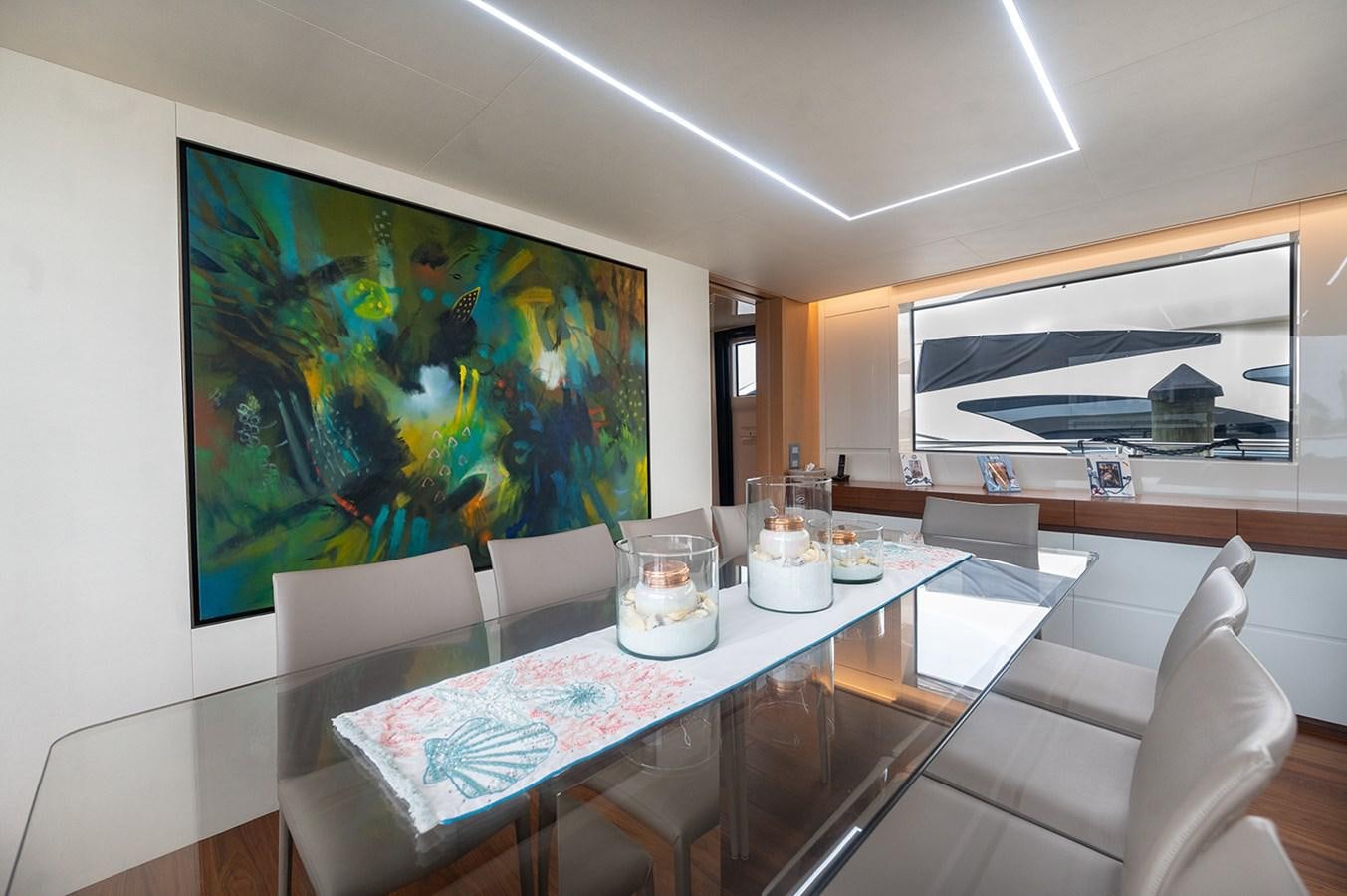 a table with a painting on it aboard RYEN Yacht for Sale