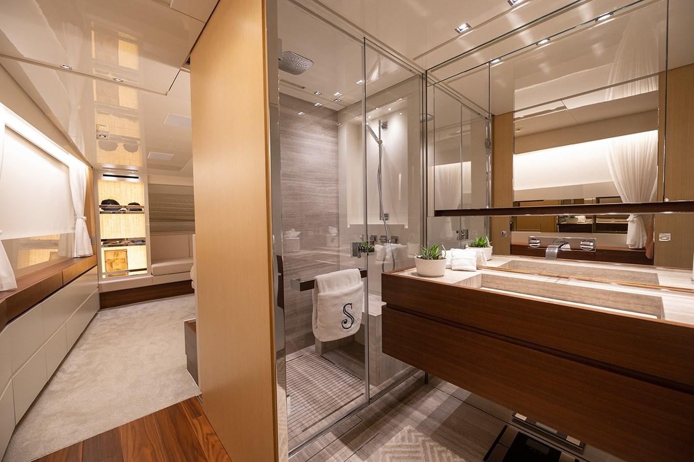 a bathroom with a glass shower aboard RYEN Yacht for Sale