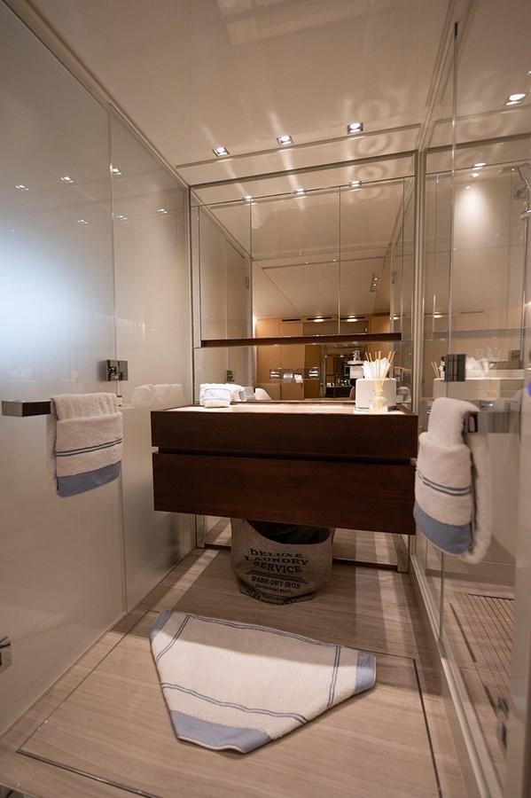 a bathroom with a sink and a mirror aboard RYEN Yacht for Sale