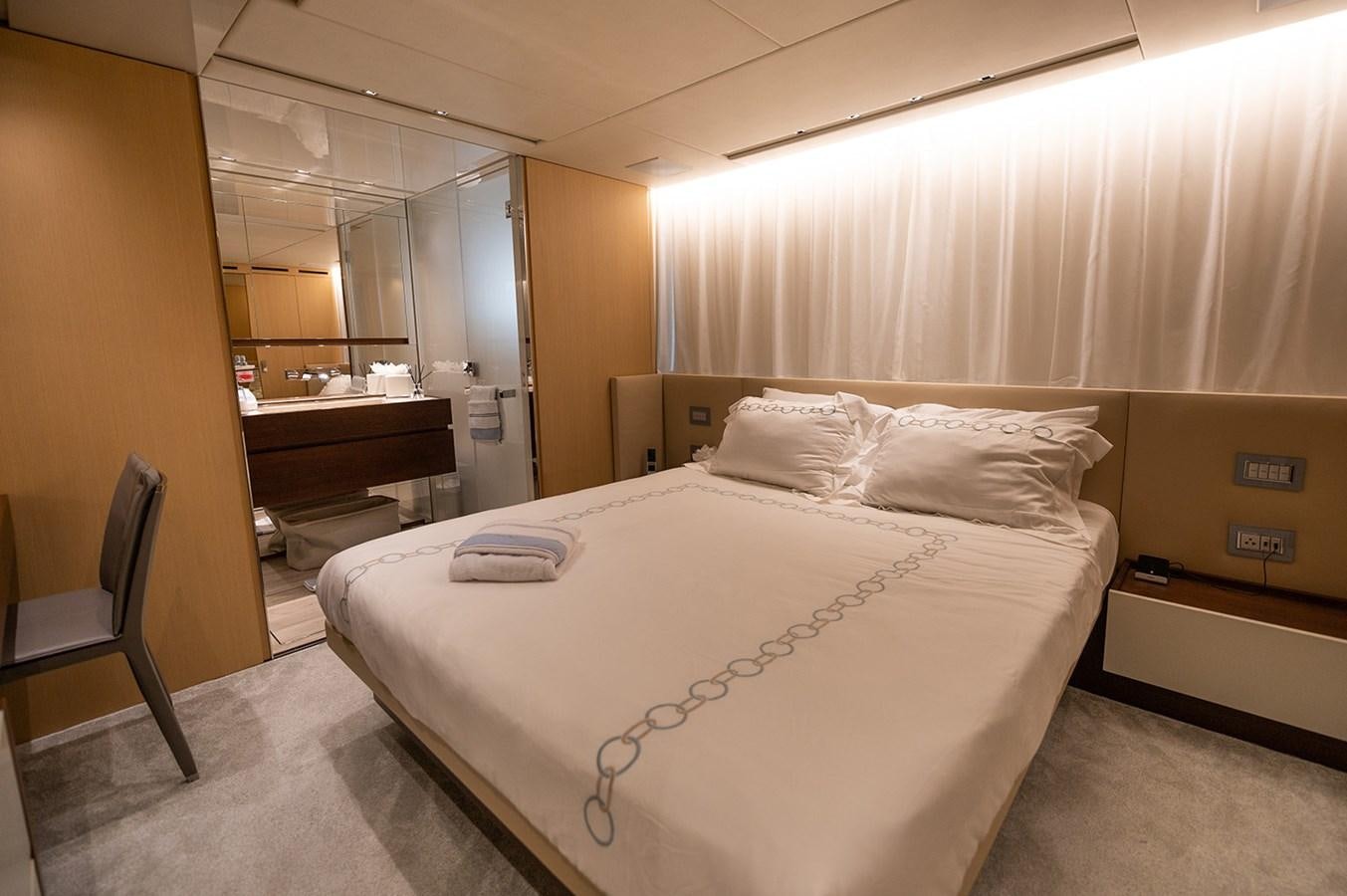 a bed in a room aboard RYEN Yacht for Sale
