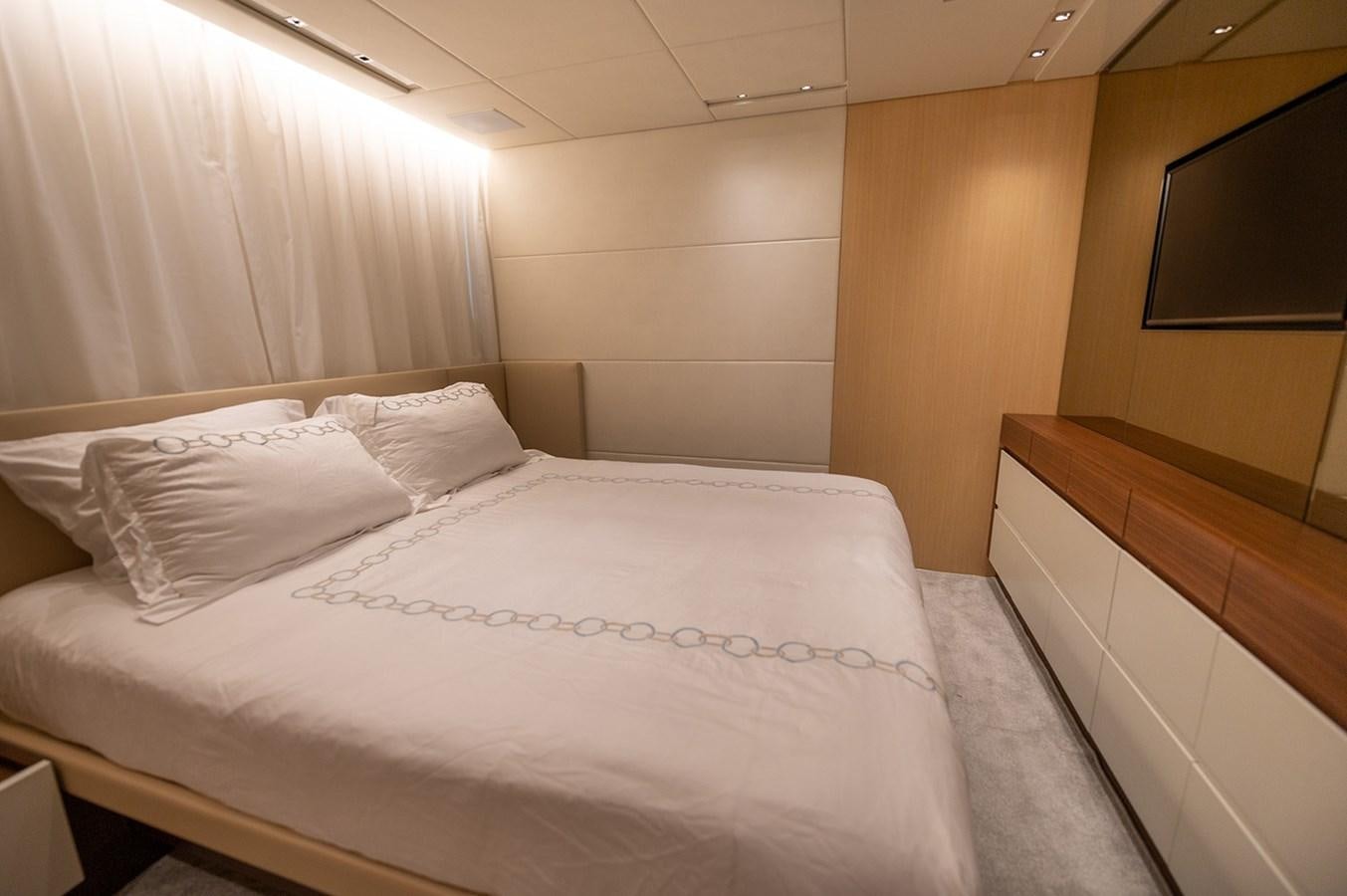 a bed with white sheets aboard RYEN Yacht for Sale