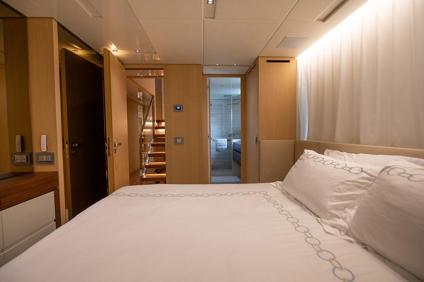 a bed in a hotel room aboard RYEN Yacht for Sale