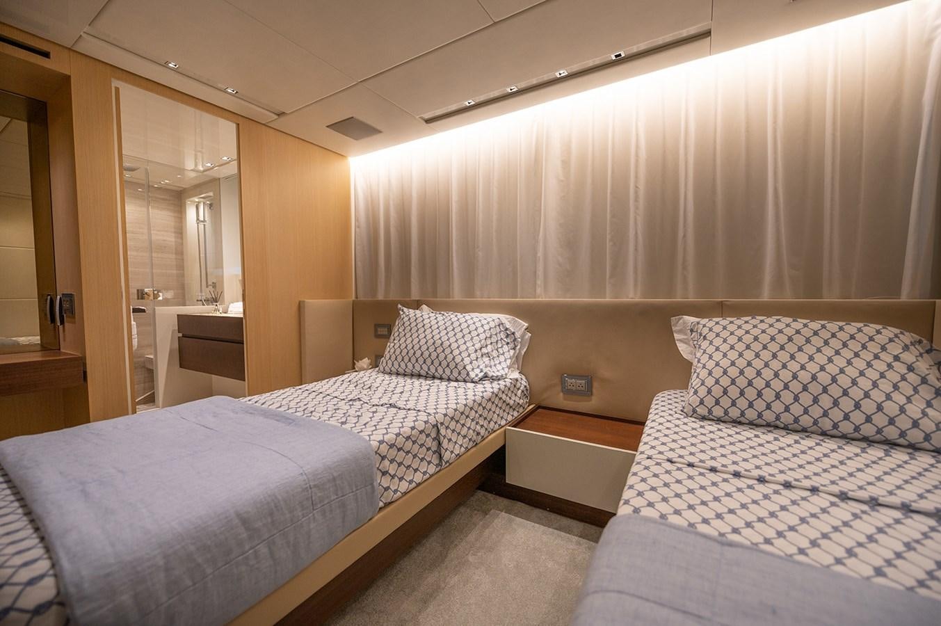 a couple of beds in a hotel room aboard RYEN Yacht for Sale