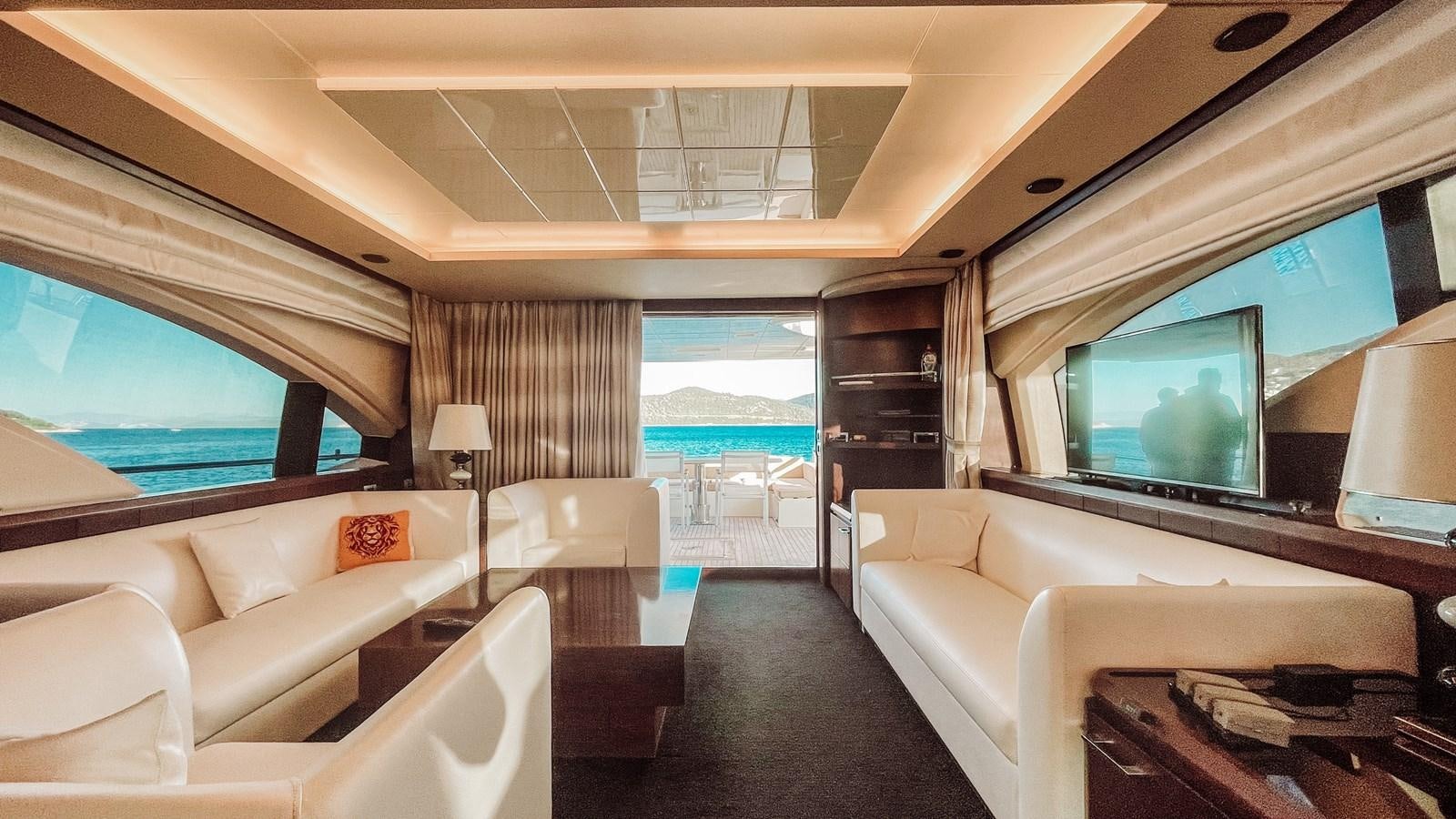 a room with a large television and a large window aboard AZIMUT 88 Yacht for Sale