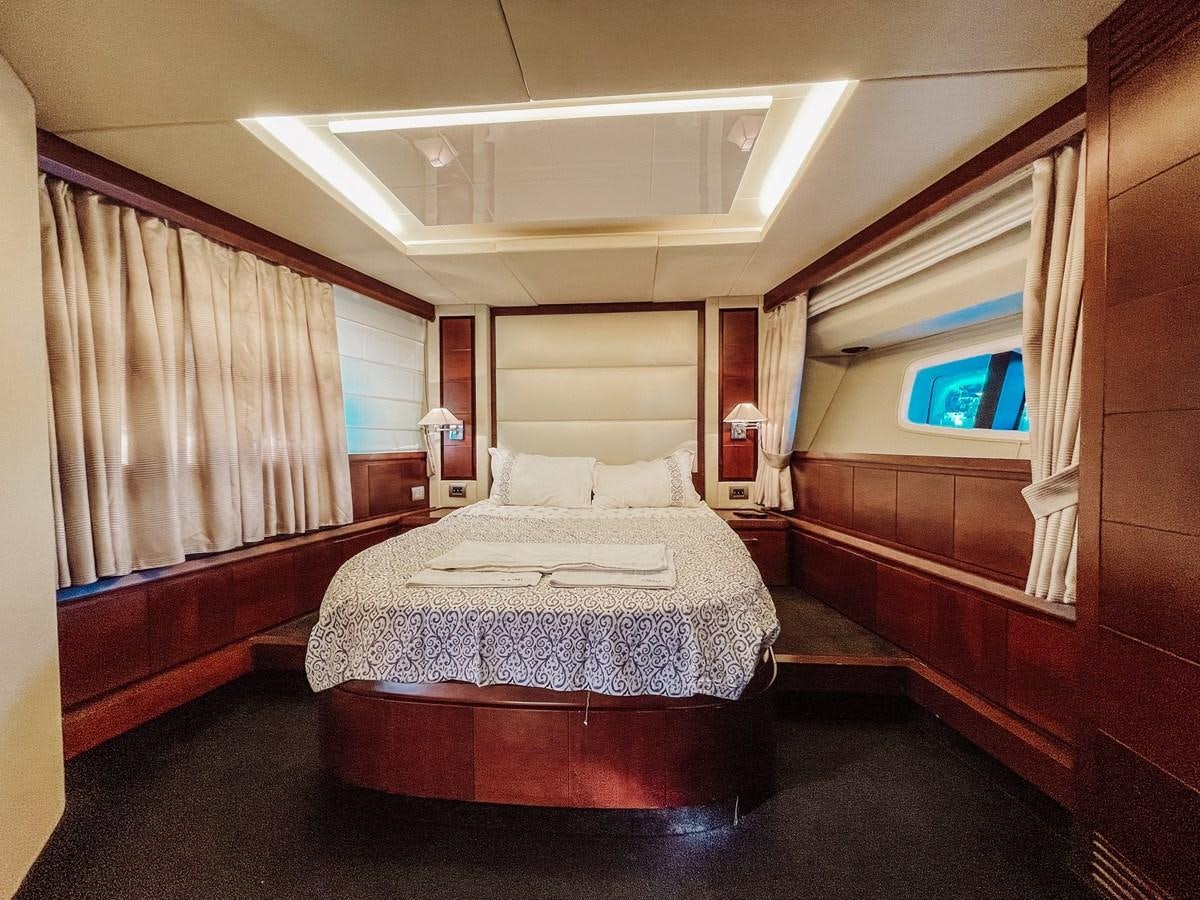 a bed in a room aboard AZIMUT 88 Yacht for Sale