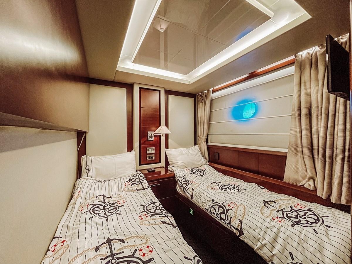 a room with two beds aboard AZIMUT 88 Yacht for Sale