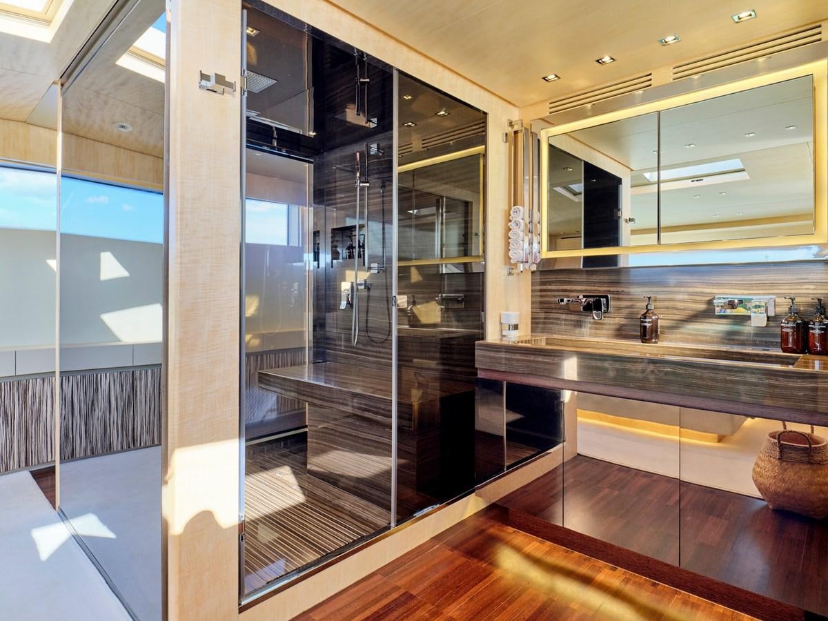 a large glass shower unit in a room with a wood floor aboard RARE DIAMOND Yacht for Sale