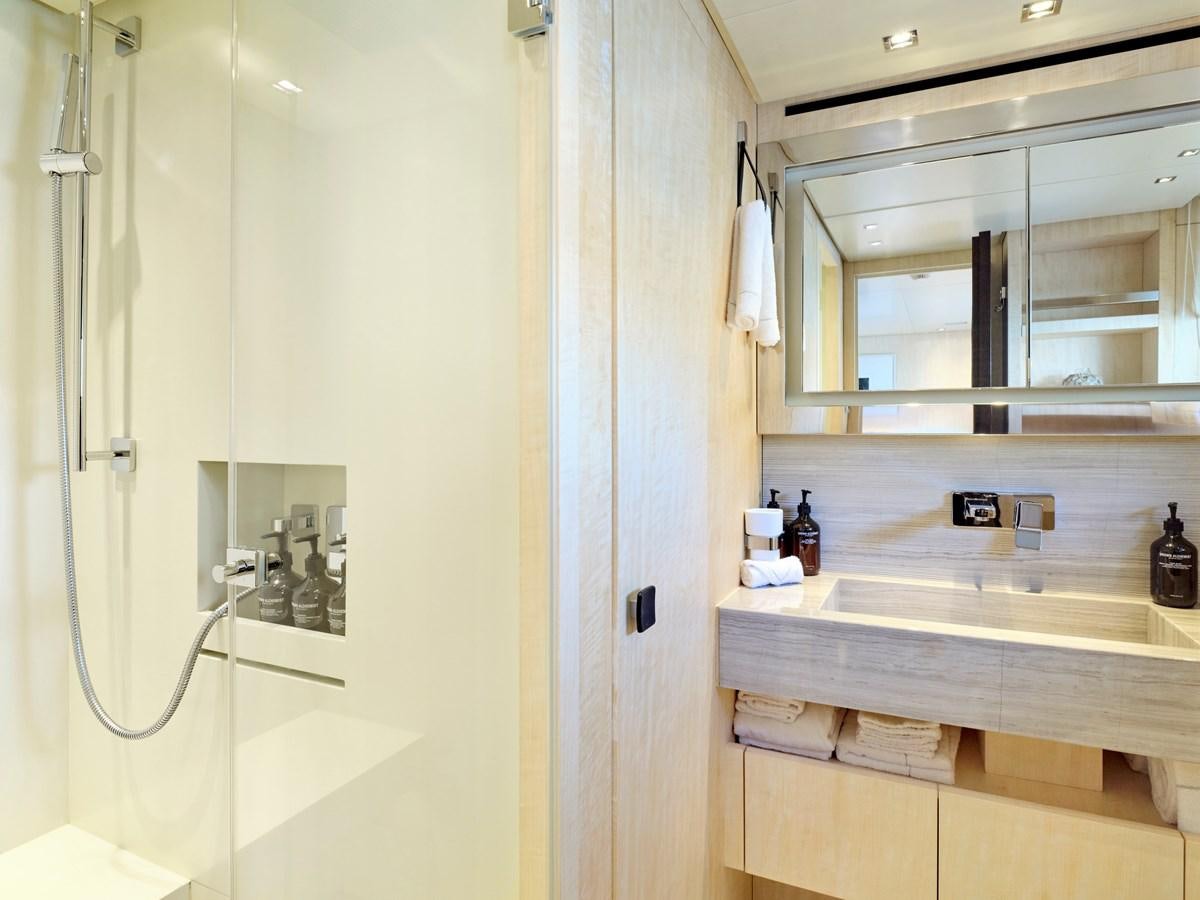 a bathroom with a sink and a mirror aboard RARE DIAMOND Yacht for Sale