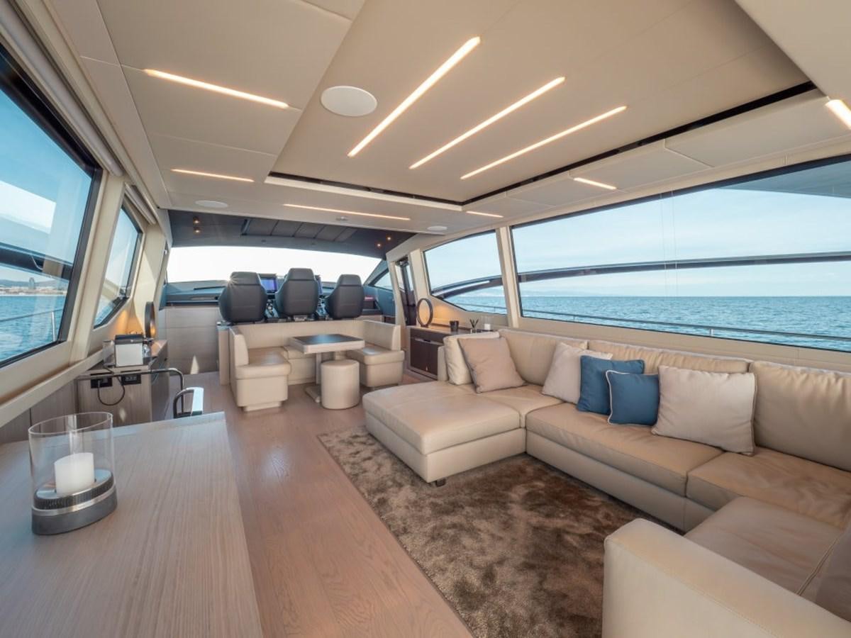 a living room with a large window aboard SURVIVOR Yacht for Sale