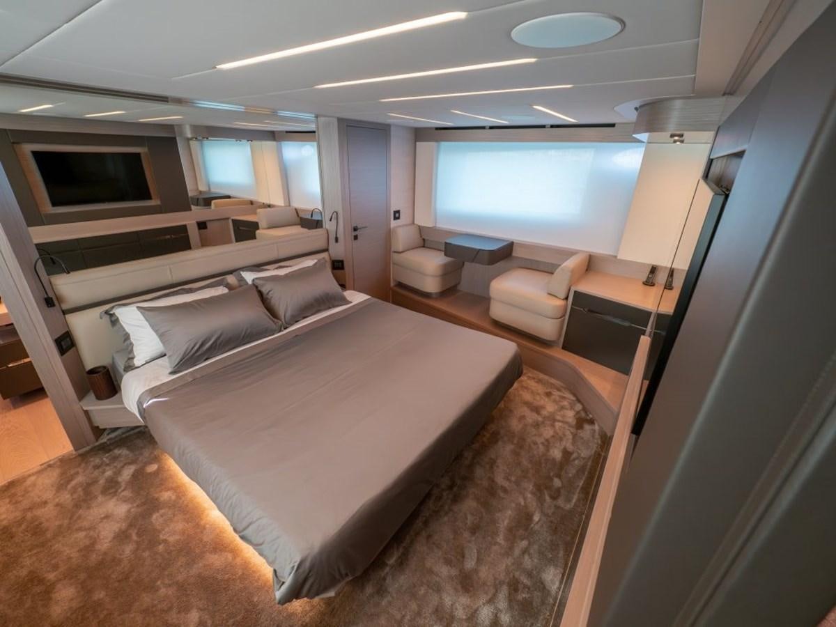 a room with a bed and a window aboard SURVIVOR Yacht for Sale