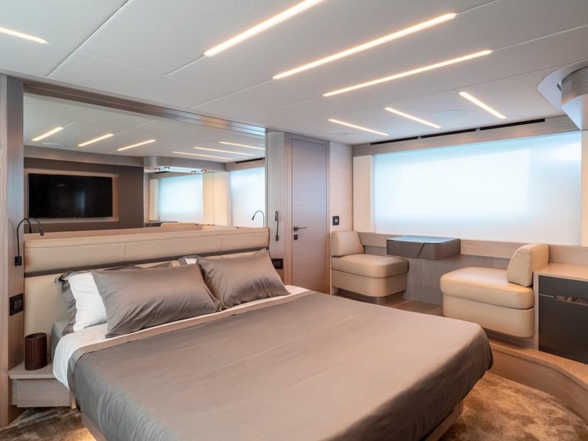 a large bedroom with a bed aboard SURVIVOR Yacht for Sale