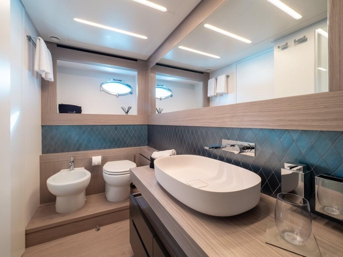 a bathroom with a sink and a toilet aboard SURVIVOR Yacht for Sale
