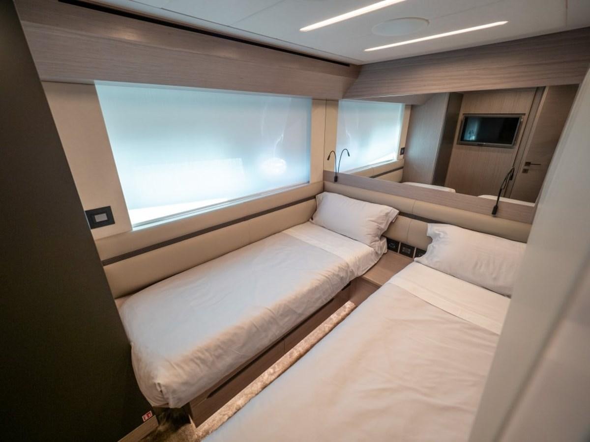 a room with a bed and a window aboard SURVIVOR Yacht for Sale
