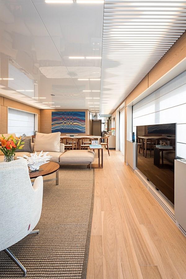 a living room with a wood floor aboard ANINHA 1 Yacht for Sale