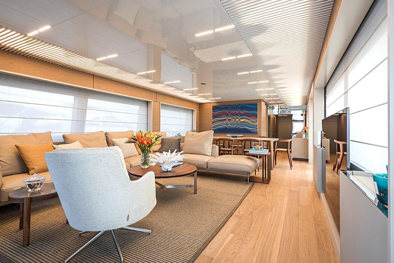 a living room with a large window aboard ANINHA 1 Yacht for Sale