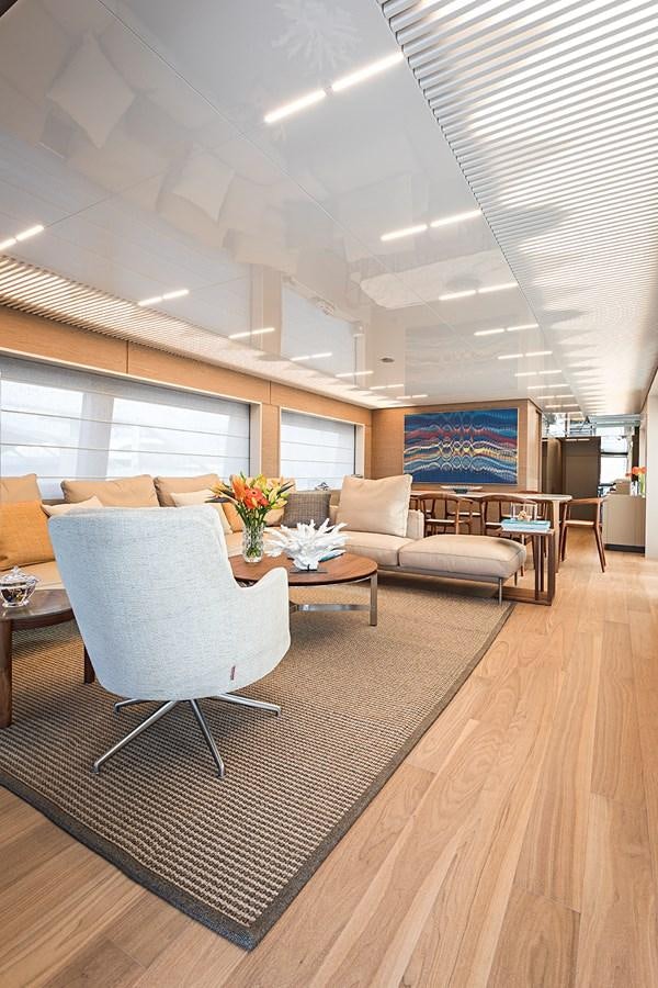 a living room with a wood floor aboard ANINHA 1 Yacht for Sale