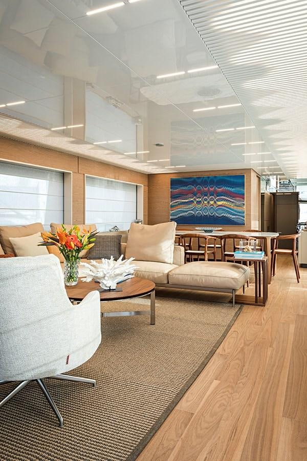 a living room with a table and chairs aboard ANINHA 1 Yacht for Sale