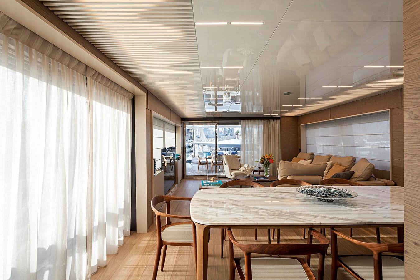 a dining room with a table and chairs aboard ANINHA 1 Yacht for Sale