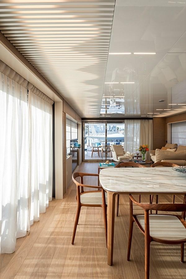 a room with a table and chairs aboard ANINHA 1 Yacht for Sale