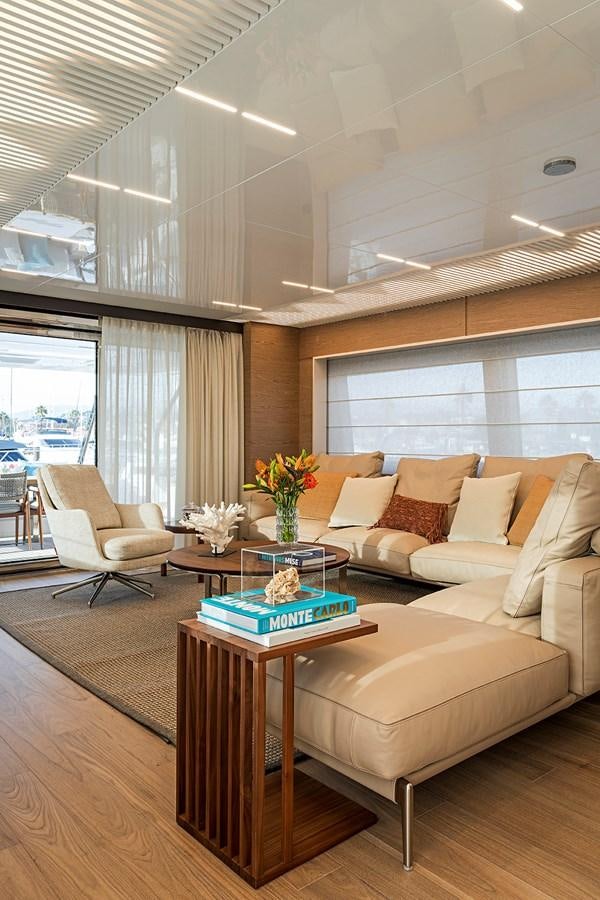 a living room with a couch and a coffee table aboard ANINHA 1 Yacht for Sale