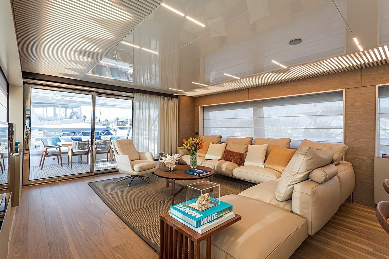 a living room with a couch and a table aboard ANINHA 1 Yacht for Sale