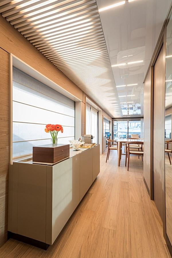 a room with a large window and a wood floor aboard ANINHA 1 Yacht for Sale