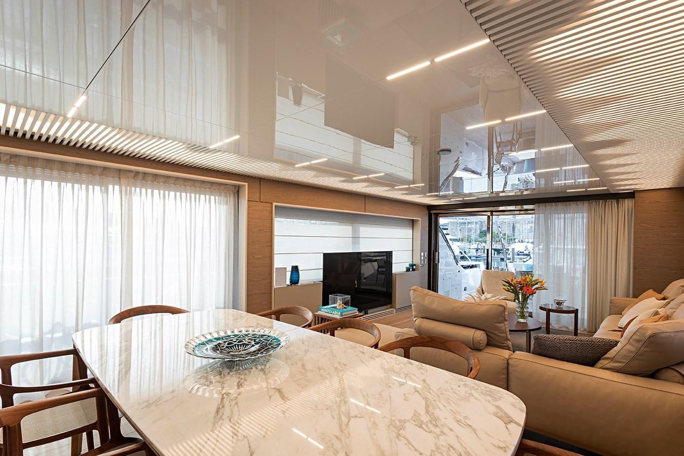 a living room with a large window aboard ANINHA 1 Yacht for Sale