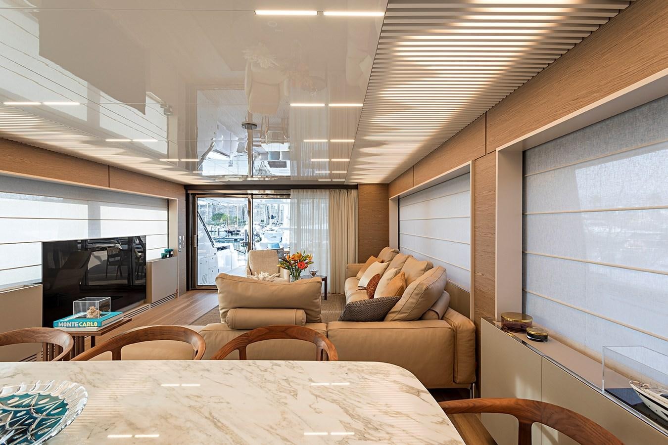 a living room with a couch and a table aboard ANINHA 1 Yacht for Sale