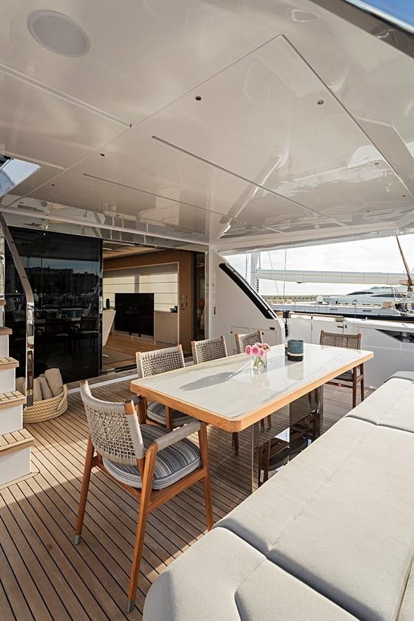 a table and chairs on a deck aboard ANINHA 1 Yacht for Sale
