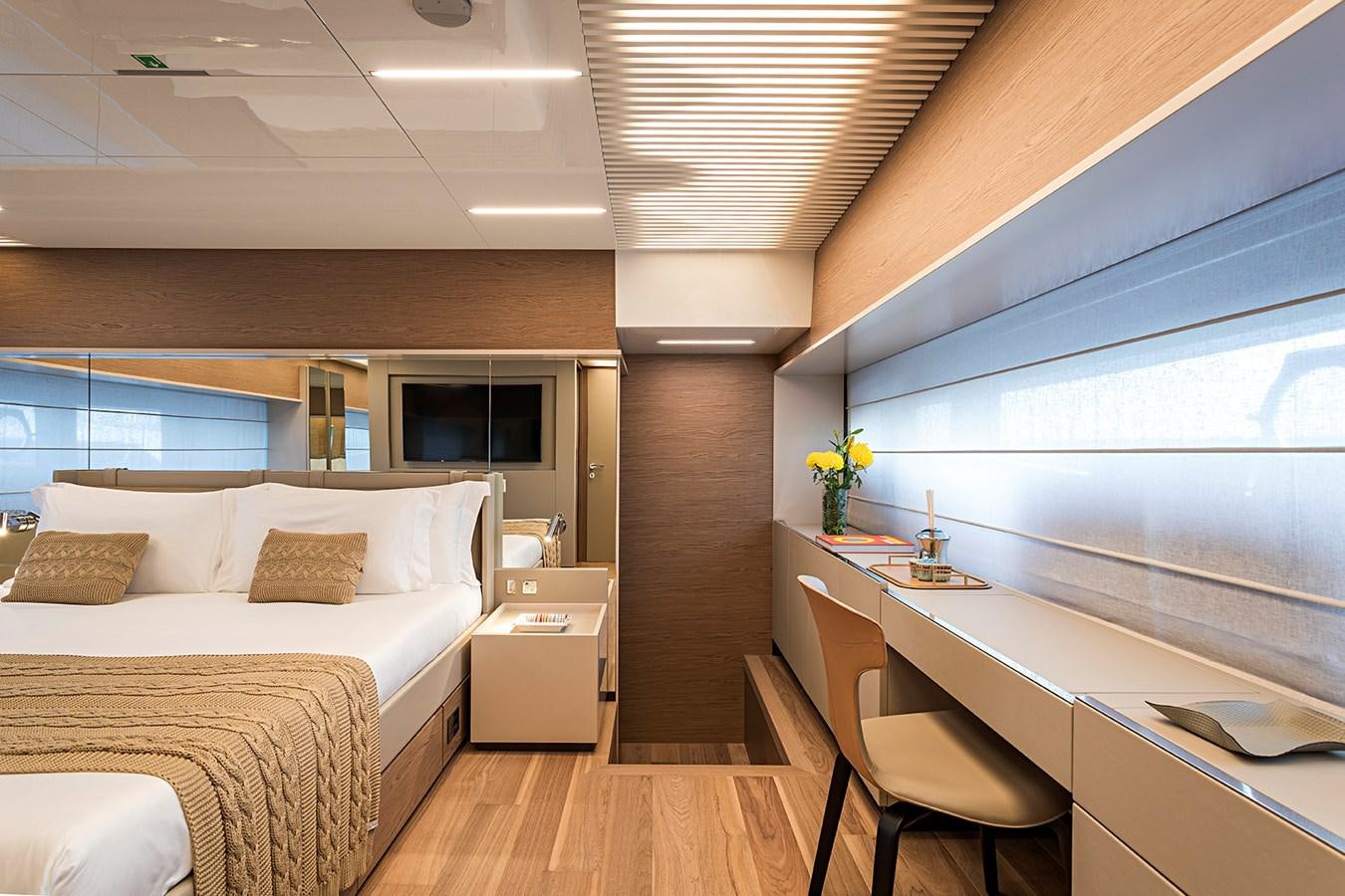 a room with a bed and a desk aboard ANINHA 1 Yacht for Sale