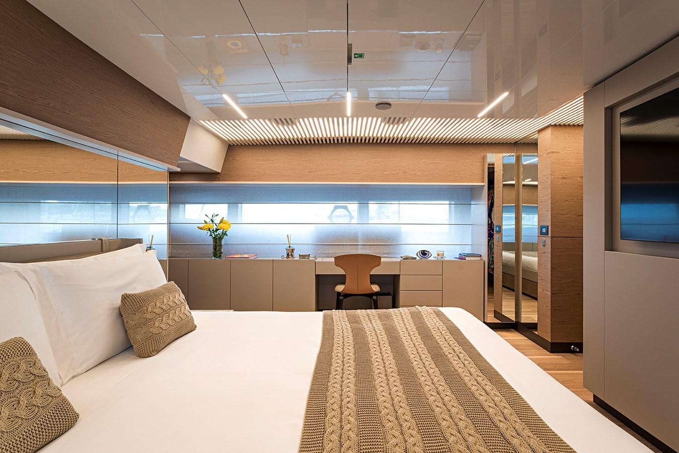 a room with a bed and a chair aboard ANINHA 1 Yacht for Sale