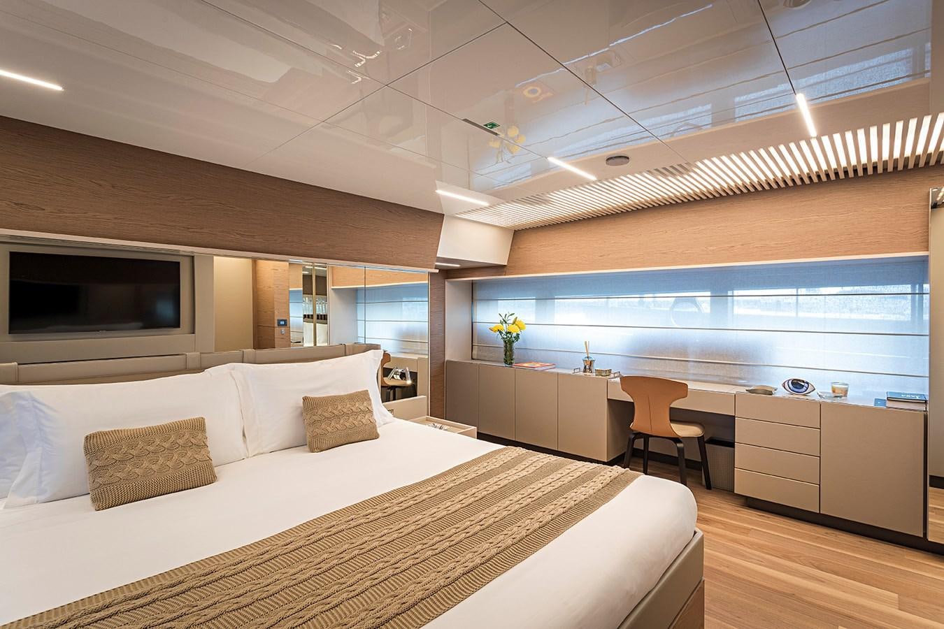 a modern bedroom with a large bed aboard ANINHA 1 Yacht for Sale