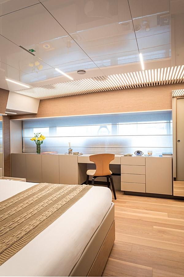 a room with a bed and a desk aboard ANINHA 1 Yacht for Sale