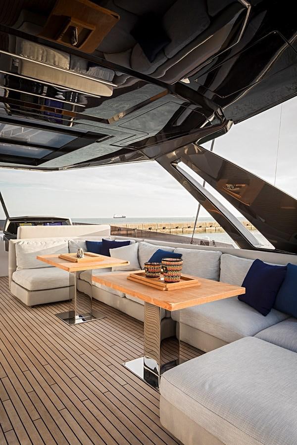 a room with a table and couches aboard ANINHA 1 Yacht for Sale