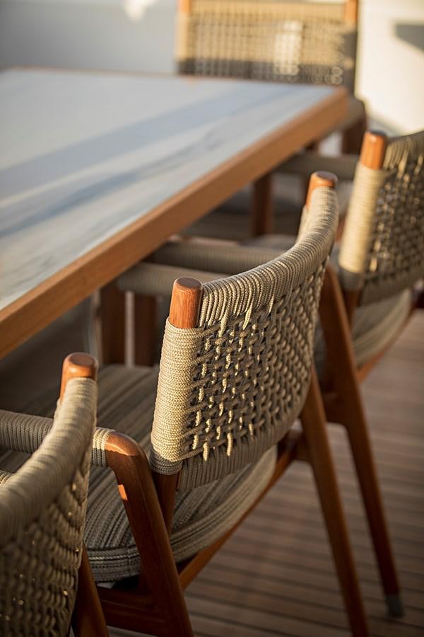 a wooden chair with a wooden seat aboard ANINHA 1 Yacht for Sale