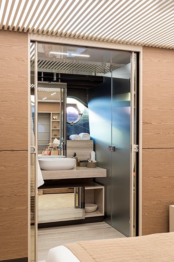 a bathroom with a large mirror aboard ANINHA 1 Yacht for Sale