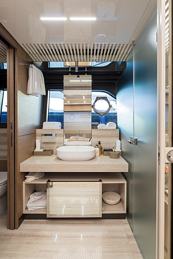 a bathroom with a sink and a mirror aboard ANINHA 1 Yacht for Sale