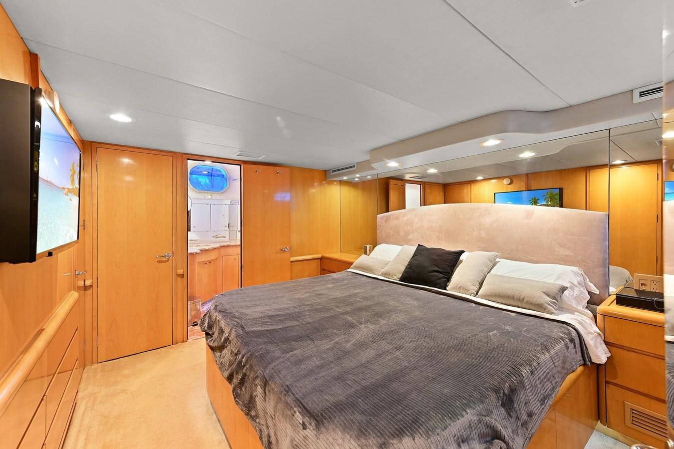 a bedroom with a bed aboard MAHA Yacht for Sale