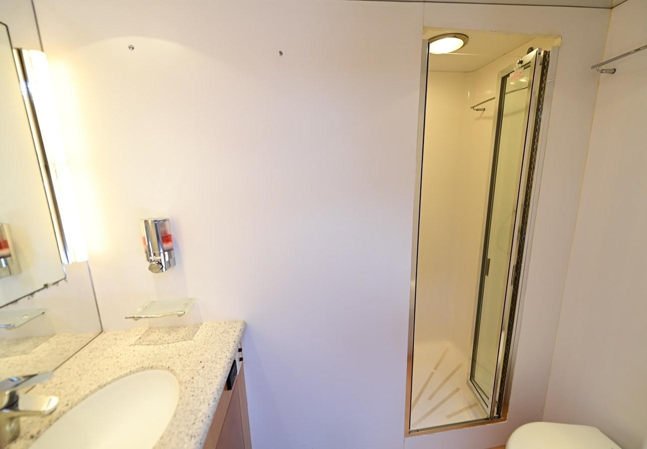 a bathroom with a sink and a mirror aboard MAHA Yacht for Sale