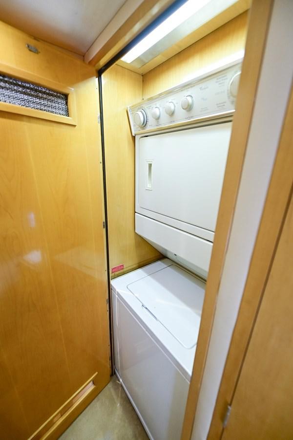 a white washing machine aboard MAHA Yacht for Sale