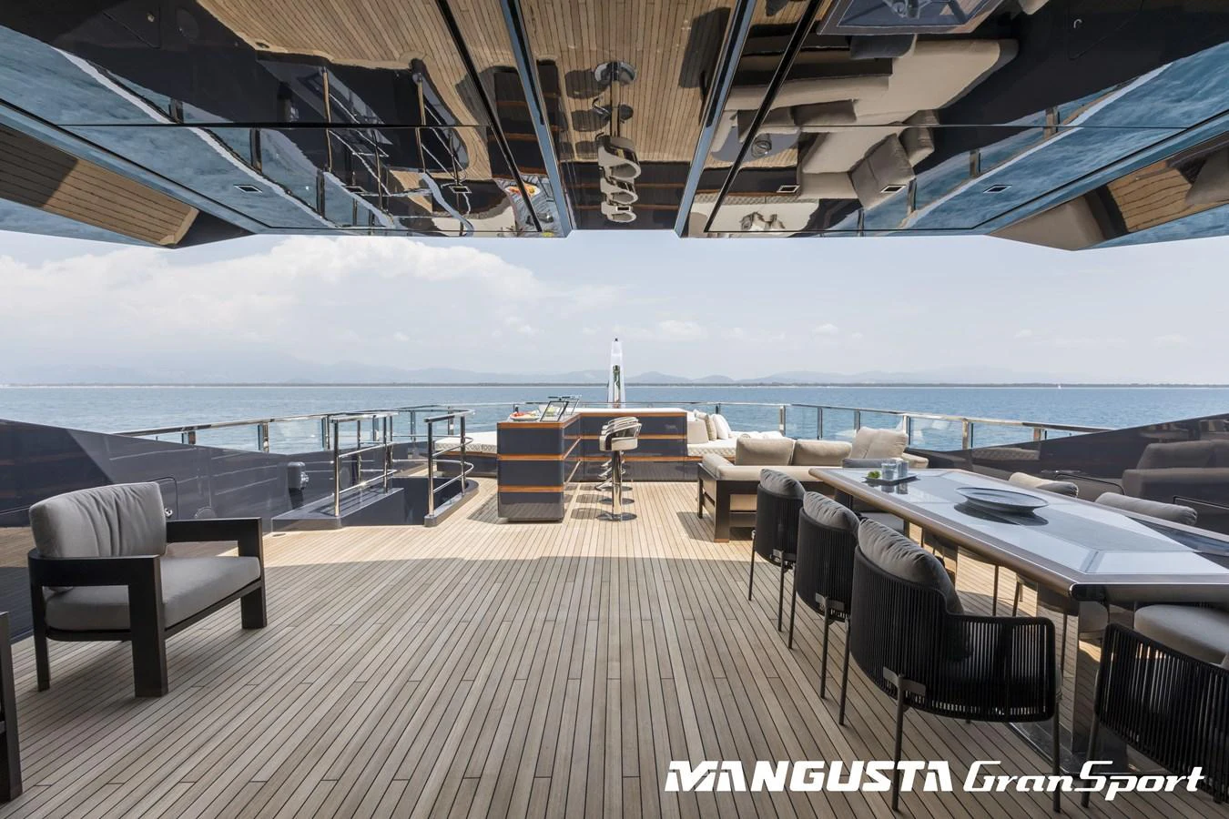 a deck with a view of the ocean and the deck aboard RR Yacht for Sale
