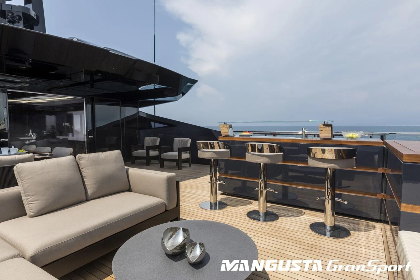 a living room with a large window overlooking the ocean aboard RR Yacht for Sale