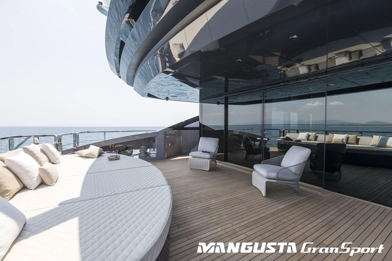 a room with a bed and a chair aboard RR Yacht for Sale