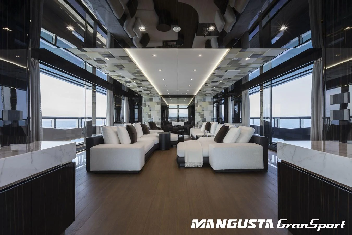 a room with a couch and a table aboard RR Yacht for Sale