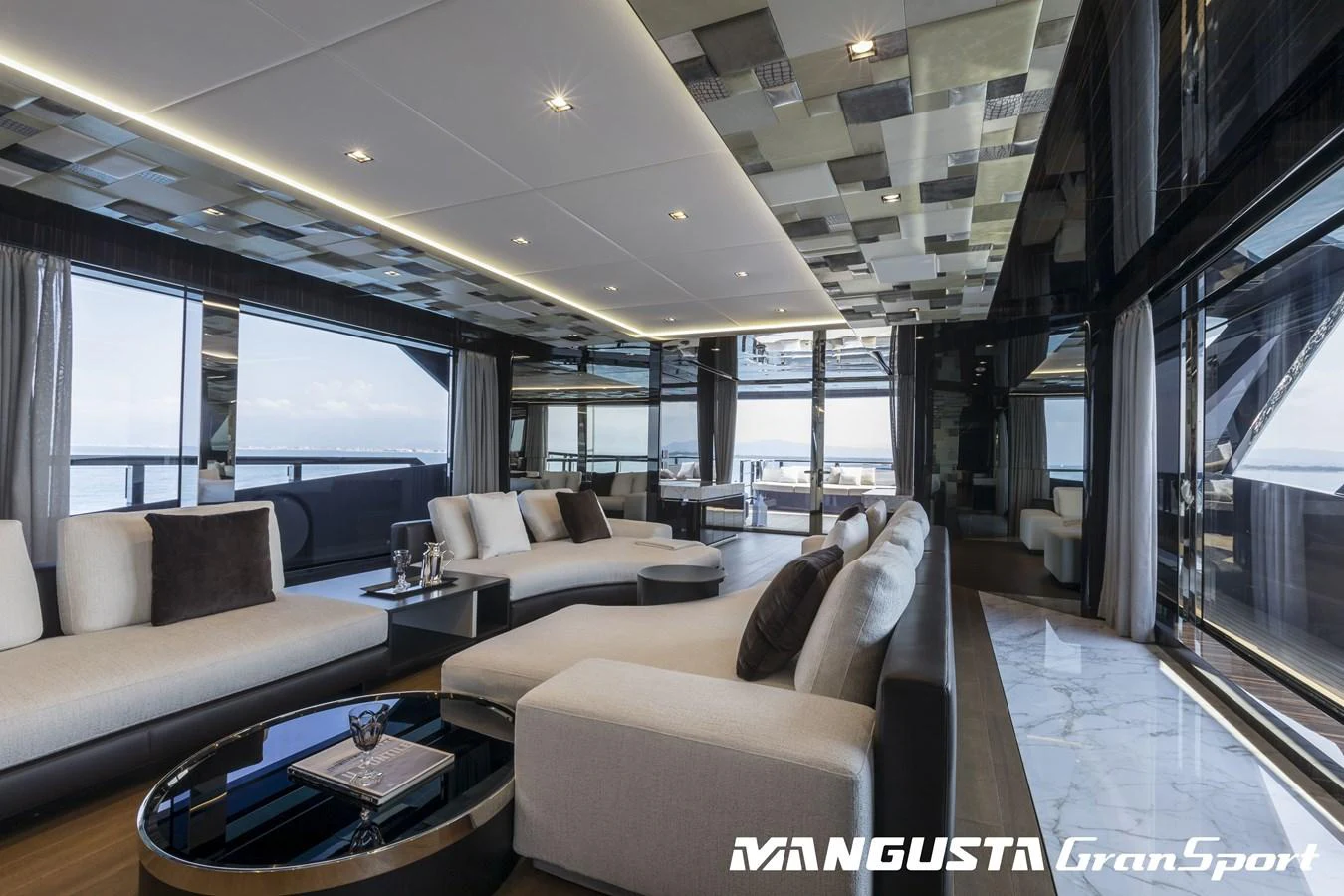 a living room with a large window aboard RR Yacht for Sale