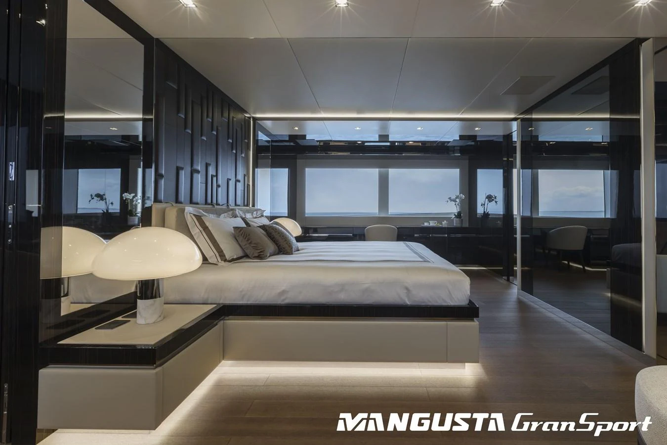 a room with a bed and a table aboard RR Yacht for Sale